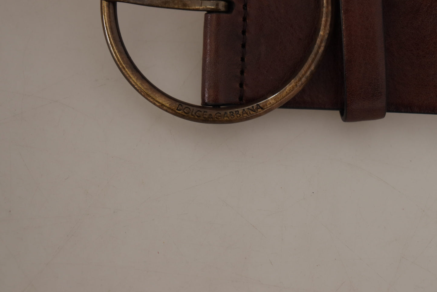 Dolce & Gabbana Elegant Leather Belt with Engraved Buckle - KALAJ