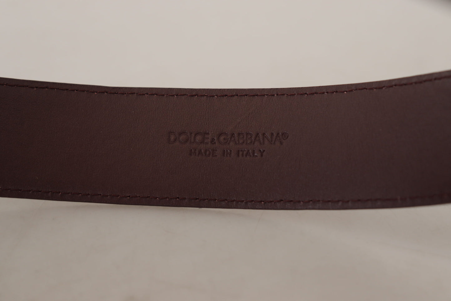 Dolce & Gabbana Elegant Maroon Leather Belt with Engraved Buckle - KALAJ