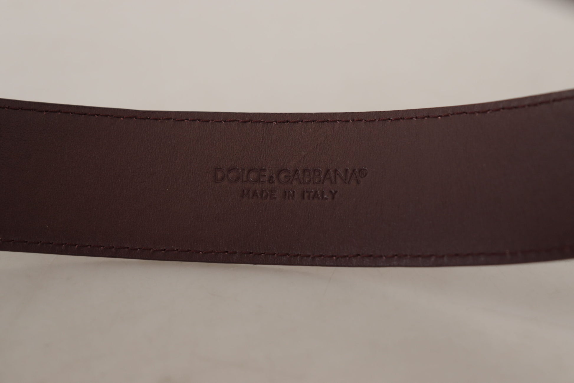 Dolce & Gabbana Elegant Maroon Leather Belt with Engraved Buckle - KALAJ