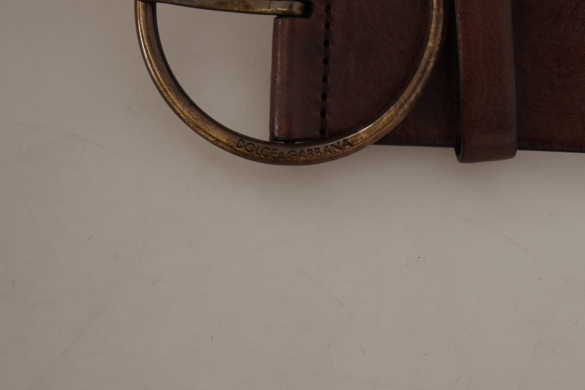 Dolce & Gabbana Elegant Leather Belt with Engraved Buckle - KALAJ